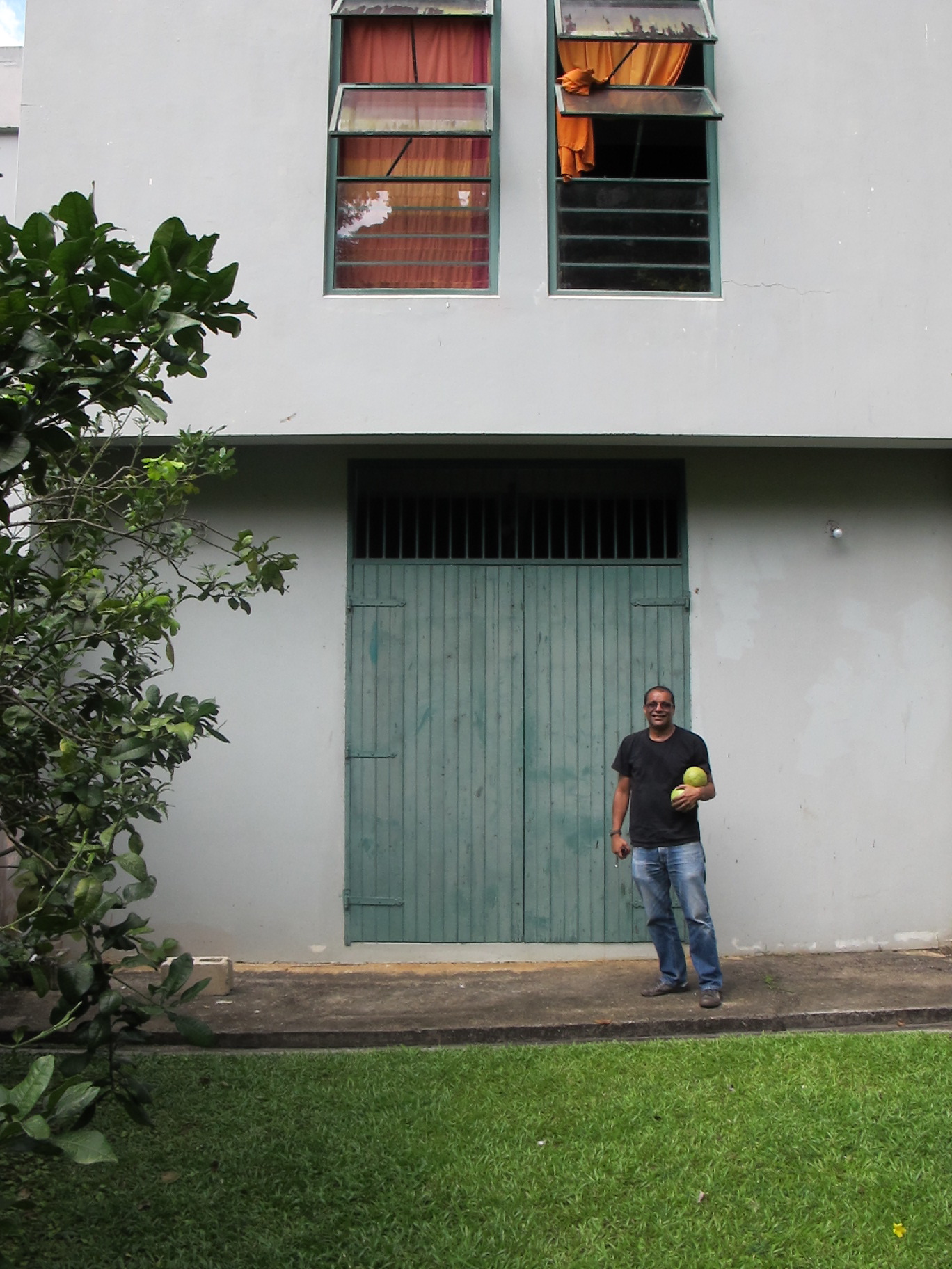 Cozier standing outside his studio doors