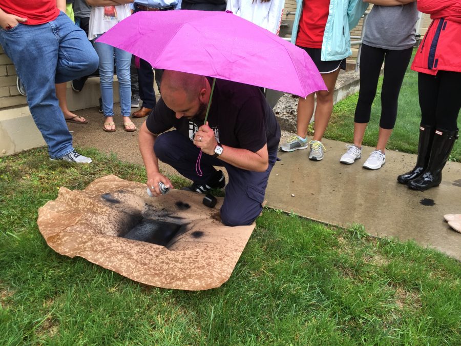 Avoiding the rain, Hobbs applied spray paint to the zinc plate in place of hard ground.