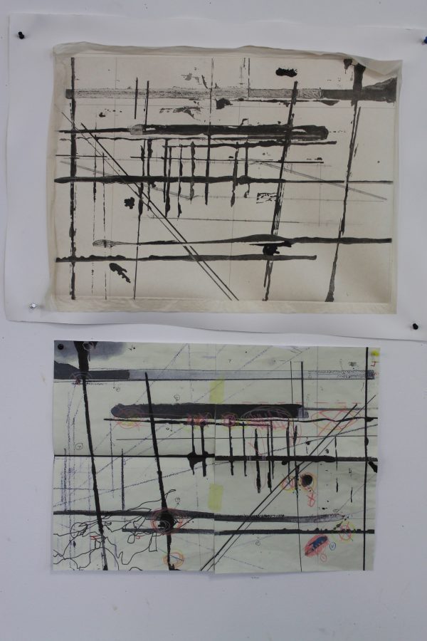 Proofs of two of the prints are pinned to the wall above the drawings that they are based on. The same design can be seen in the prints in reverse. The third print as conceptualised later in the process. 