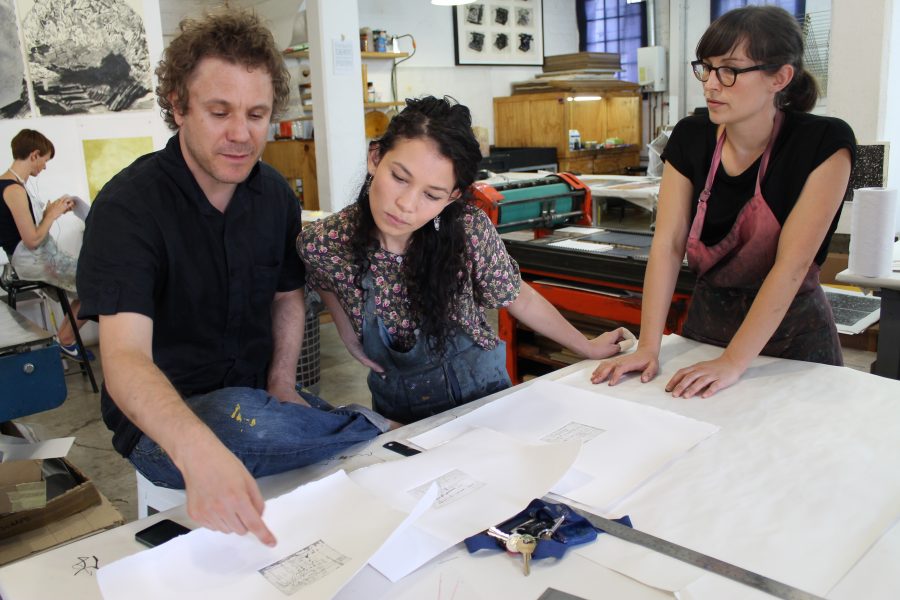 A collaborative process: Nassimbeni discusses the proofs of his mini-prints with Jill and Kim-Lee. 