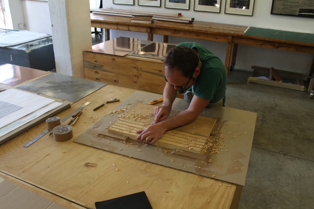 Carving the woodcut...