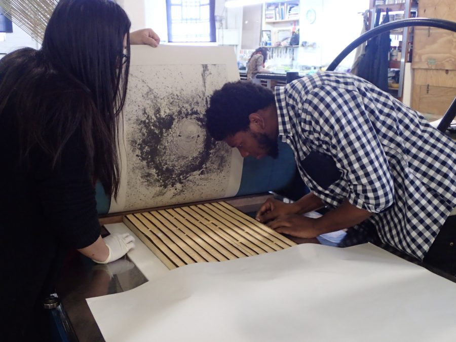 Pressure's on: Khulu and Cortez register the block to align with the carborundum print to test the layering idea