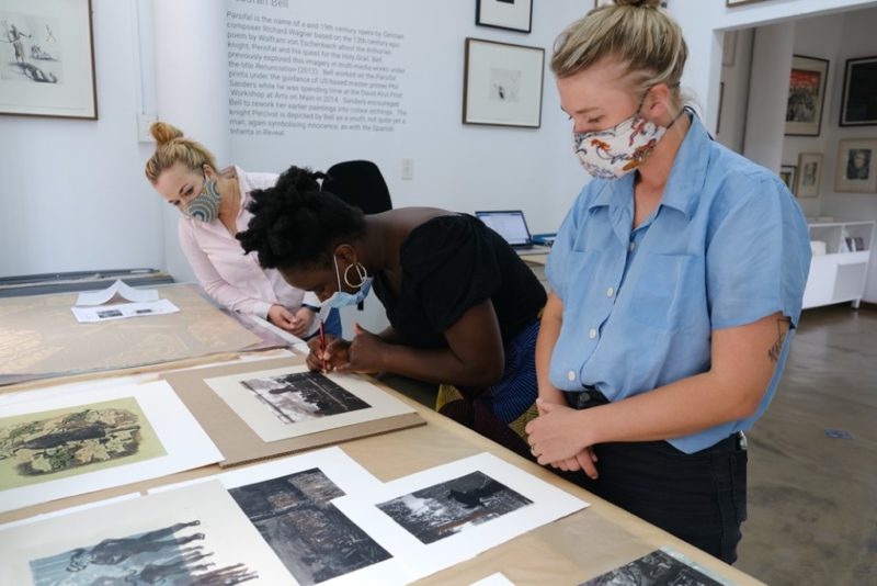 Helena signing her prints with printer Roxy Kaczmarek and gallerist Britt Lawton at David Krut Projects, Johannesburg, 2020 